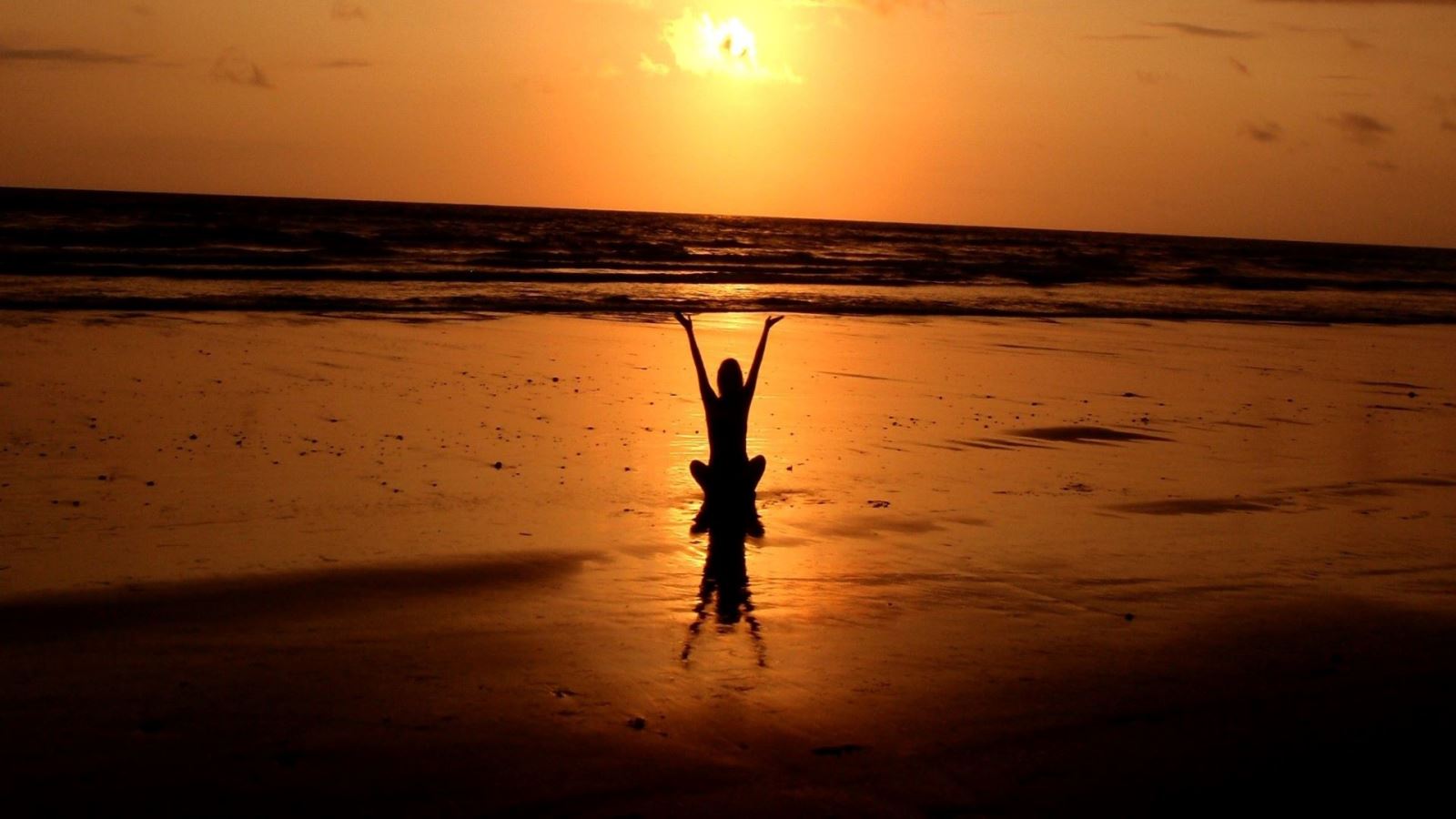 Yoga at sunset on beach
