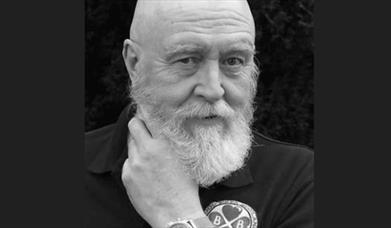 A headshot of the Scottish folk singer-songwriter Ian Bruce in black and white against a plain background