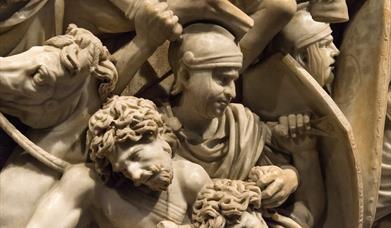 A marble statue of Romans fighting barbarians