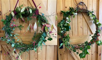 Two wreathes made from evergreen foliage with bright berries