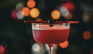A red festive cocktail in Chuck.