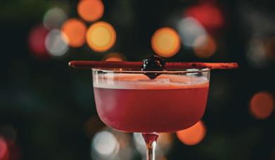 A red festive cocktail in Chuck.