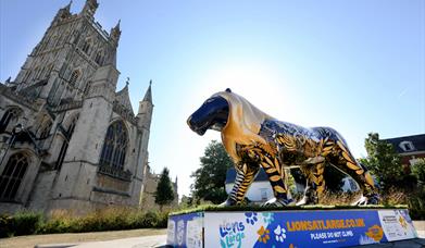 Lions sculpture outside Gloucester cathedral