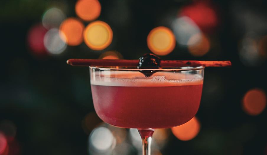 A red festive cocktail in Chuck.