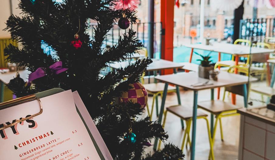 A colourful Christmas tree and decorations are up in the café.