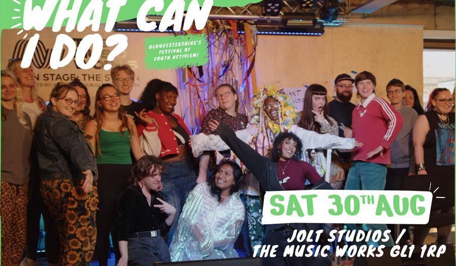 A group of young people stood together on stage at The Music Works - Text says What Can I Do? Saturday 30th August. JOLT & The Music Works