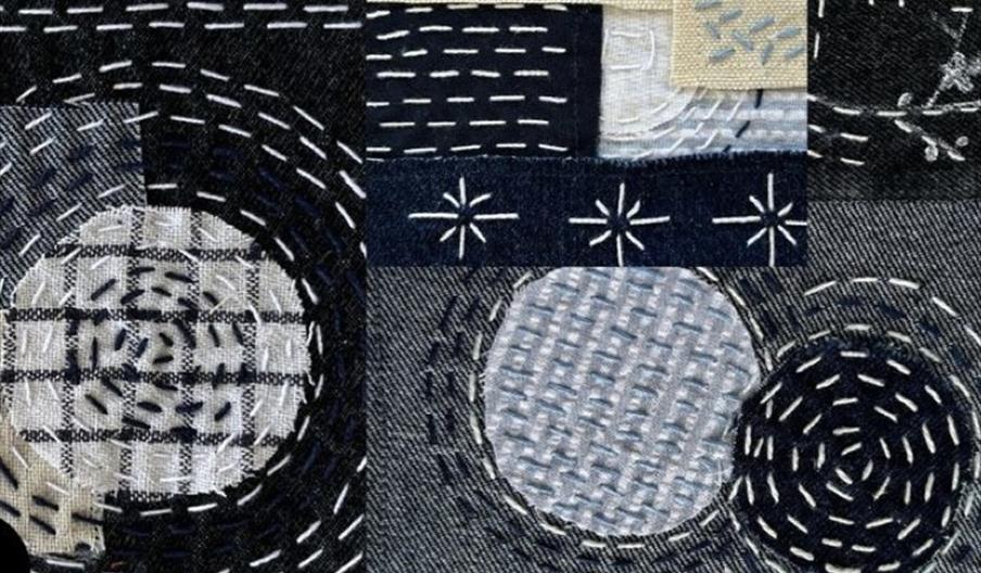 Various shades of denim embroidered with beautiful geometric patterns in white thread