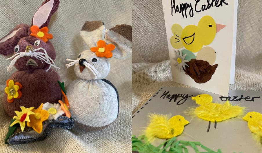 A card with yellow chicks on it and two cloth rabbits made out of socks