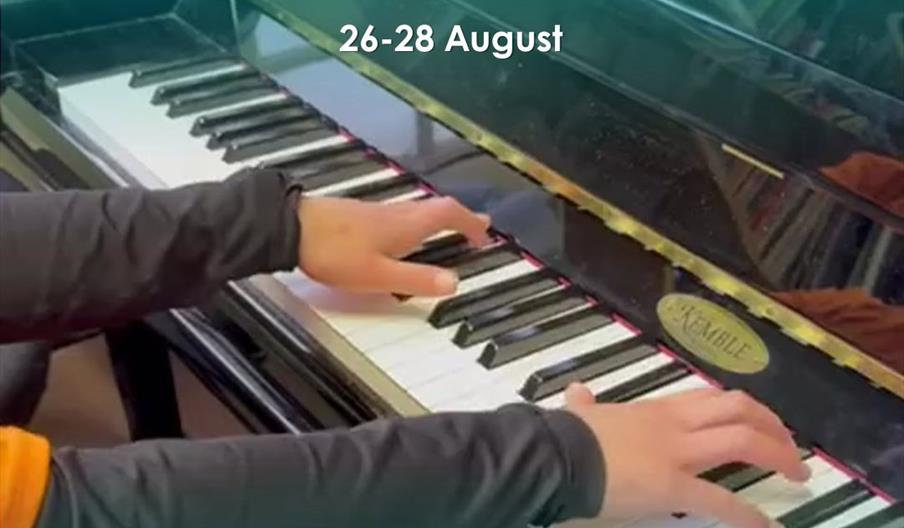 Close up hands playing piano
