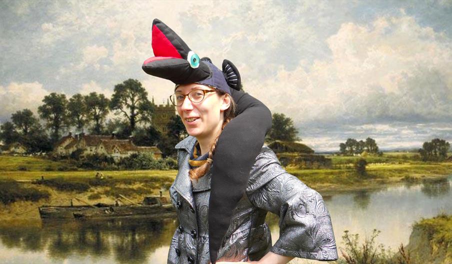 A smiling woman in a comical eel costume against the background of a watercolour painting of the River Severn