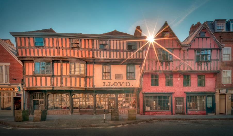 A large timber framed Tudor building on Westgate Street in Gloucester