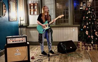 A photo of a live music performance in The Cavern