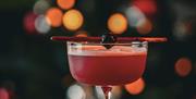 A red festive cocktail in Chuck.