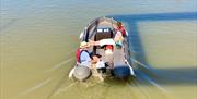 Couple relaxing on hire boat in Gloucester Docks