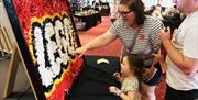 A family looking at one of our LEGO MOCS