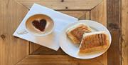 Image of coffee and panini