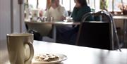 A hot drink and cookie in the cafe