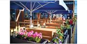 Outdoor seating at Greek on the Docks