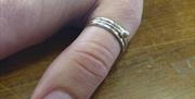 A picture containing one image of a ring that could be made on the sterling silver ring making workshop run in Gloucester, Gloucestershire by Emma Edw