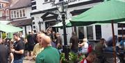 People eating outside The Fountain Inn