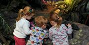 three children enjoying the Museum of Gloucester's interactive learning activities