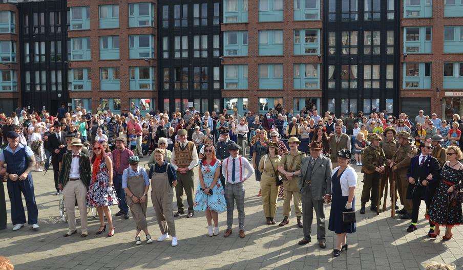 A group of people dressed for the Gloucester Goes Retro festival