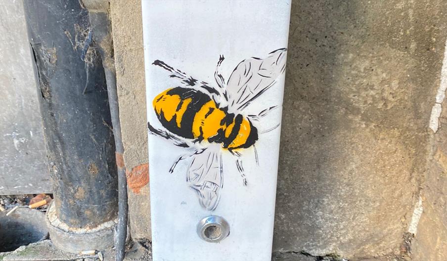 A bee painted on a fuse box