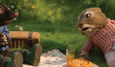 Cartoon animals having a picnic