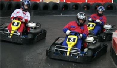 Photo of people racing at JDR Karting
